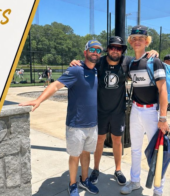 Coach G with a college coach and an 80 Scale athlete at a camp